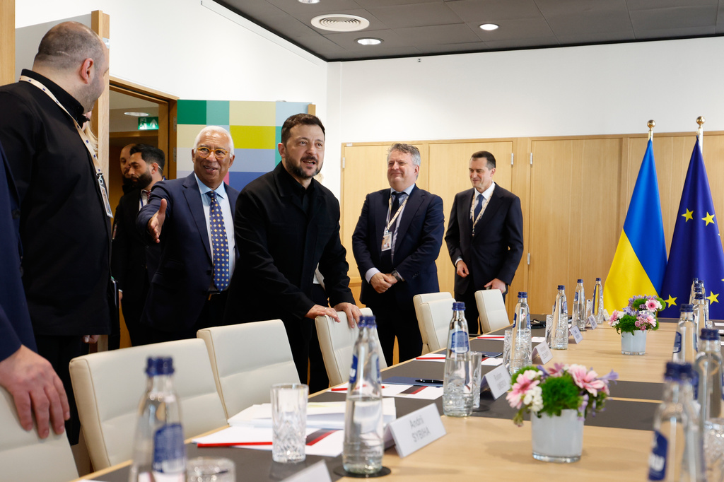 European Council President Antonio Costa, center, prepares to greet Ukraine's Chief of National Security Rustem Umerov, second left, and Ukraine's President Volodymyr Zelenskyy, center, during a meeting on the sidelines of the EU summit in Brussels, Thursday, June 18, 2026. (AP Photo/Geert Vanden Wijngaert, Pool)