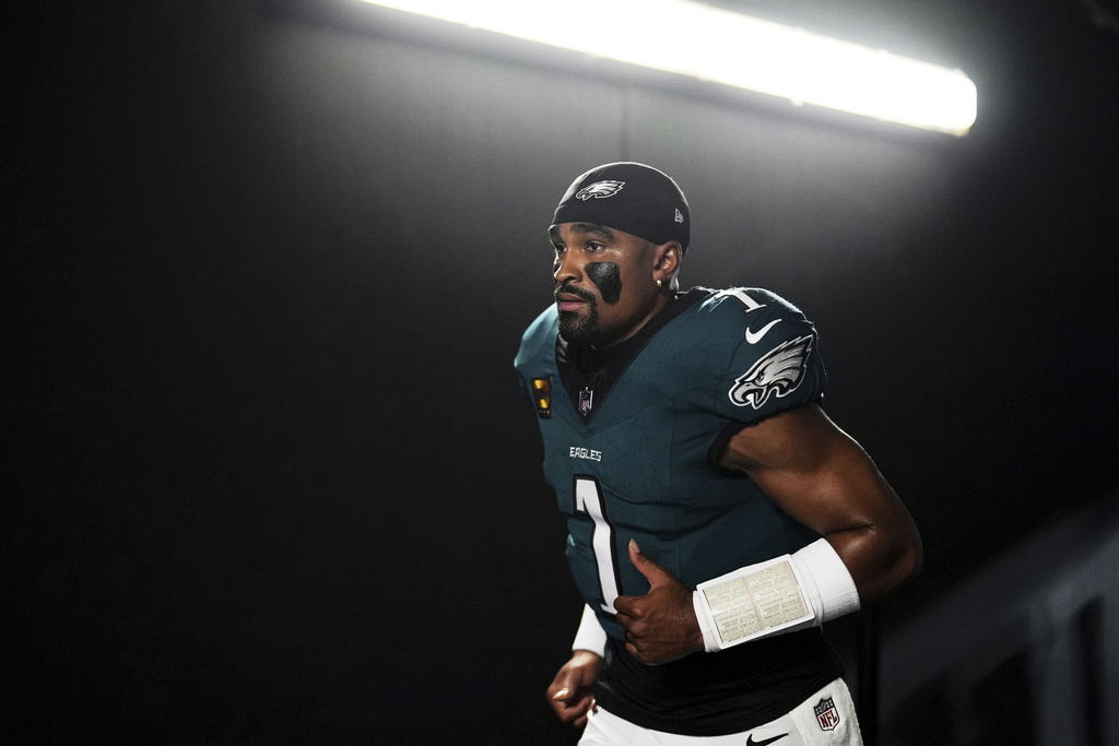 Philadelphia Eagles quarterback Jalen Hurts jogs down a tunnel before an NFL football game against the Dallas Cowboys Thursday, Sept. 4, 2025, in Philadelphia. (AP Photo/Matt Slocum)