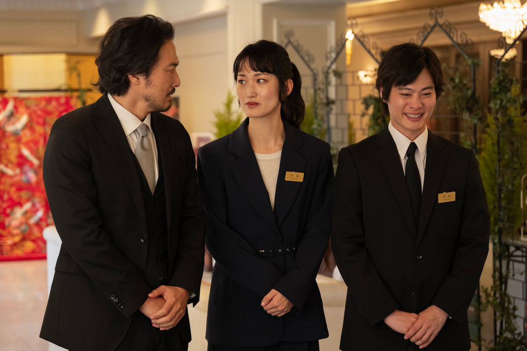This image released by Searchlight Pictures shows Takehiro Hira, from left, Mari Yamamoto, and Bun Kimura in a scene from "Rental Family." (James Lisle/Searchlight Pictures via AP)
