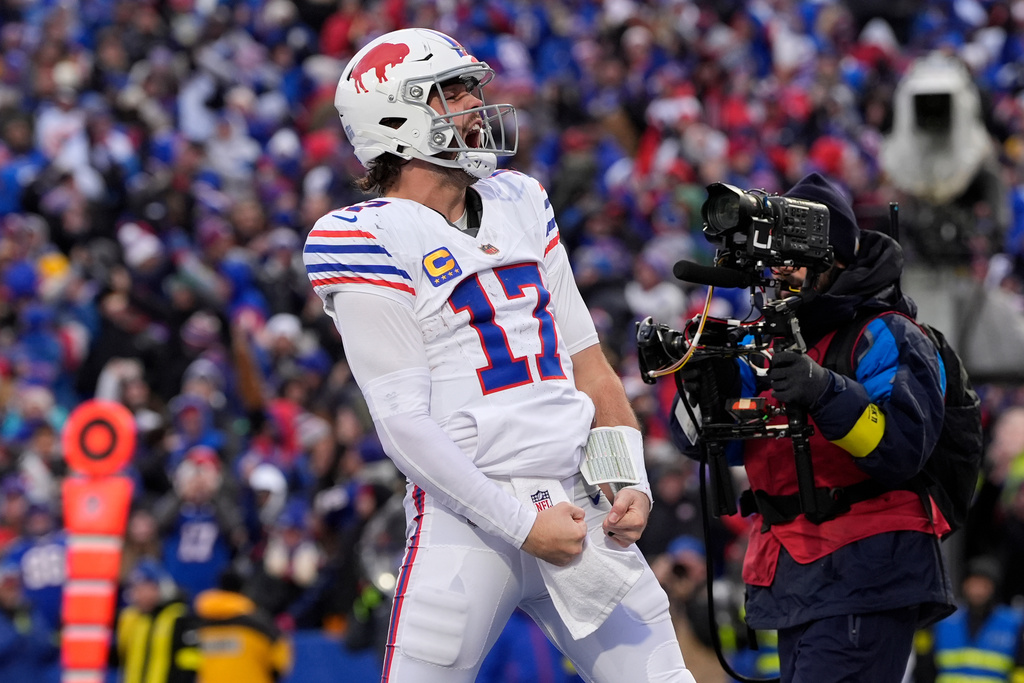 Buffalo Bills quarterback Josh Allen celebrates after scoring a touchdown against the Tampa Bay Buccaneers during the second half of an NFL football game, Sunday, Nov. 16, 2025, in Orchard Park, N.Y. (AP Photo/Carolyn Kaster)