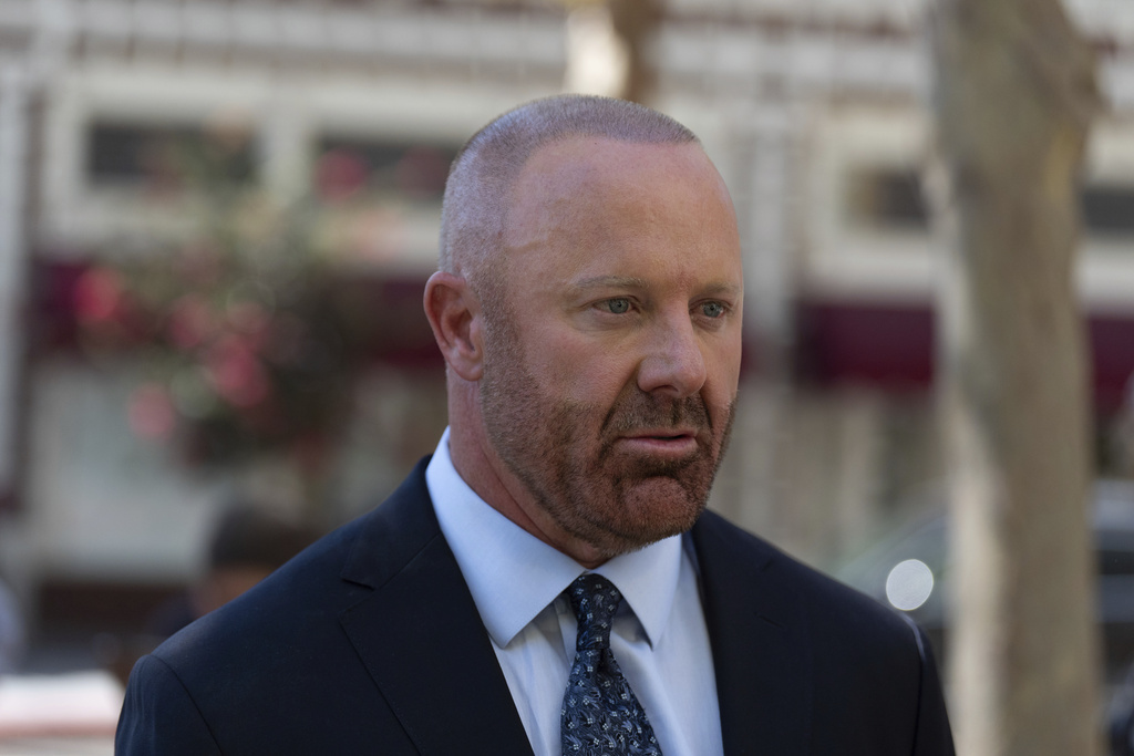 Mathew Bowyer, who pled guilty a year ago to running an illegal gambling business, money laundering and filing a false tax return, talks to his attorney outside federal court, Friday, Aug. 29, 2025, in Santa Ana, Calif., following his sentencing to 12 months and one day in prison, (AP Photo/Jae C. Hong)