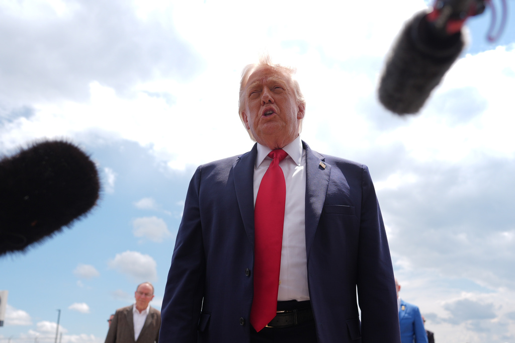 President Donald Trump talks with reporters after arriving on Air Force One, Friday, June 5, 2026, at Chippewa Valley Regional Airport in Eau Claire, Wis. (AP Photo/Mark Schiefelbein)