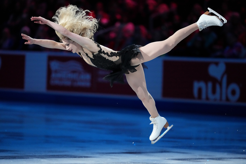 Amber Glenn skates during the "Making Team USA" performance at the U.S. Figure Skating Championships, Sunday, Jan. 11, 2026, in St. Louis. (AP Photo/Stephanie Scarbrough)