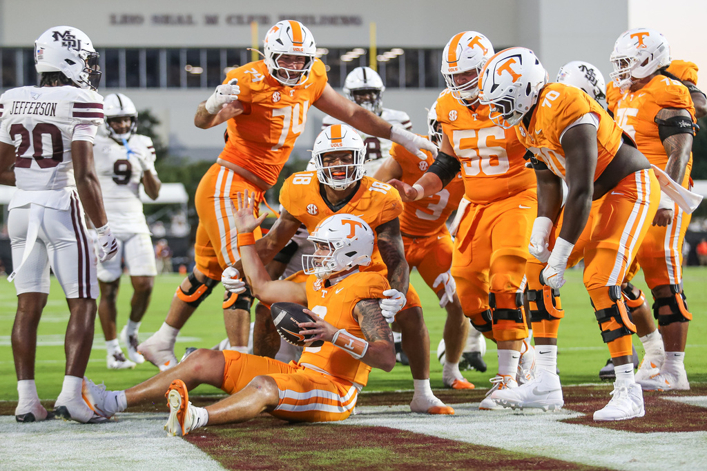 Tennessee quarterback Joey Aguilar (6) reacts with teammates after his touchdown against Mississippi State during the second half of an NCAA college football game in Starkville, Miss., Saturday, Sept. 27, 2025. (AP Photo/James Pugh)