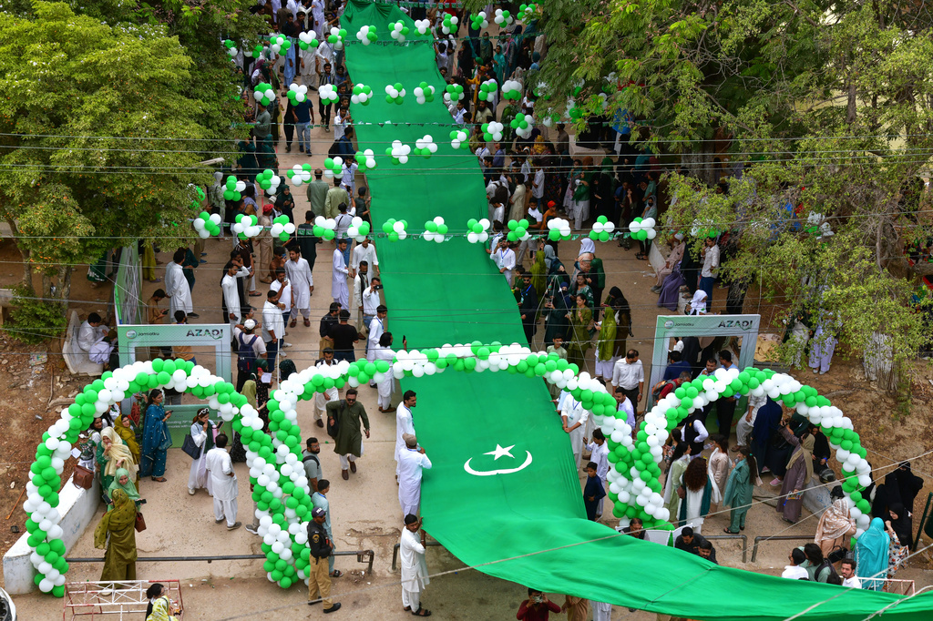 University students attend a ceremony in connection with the Pakistan's Independence Day celebrations, in Karachi, Pakistan, Thursday, Aug. 13, 2026. (AP Photo/Ali Raza)