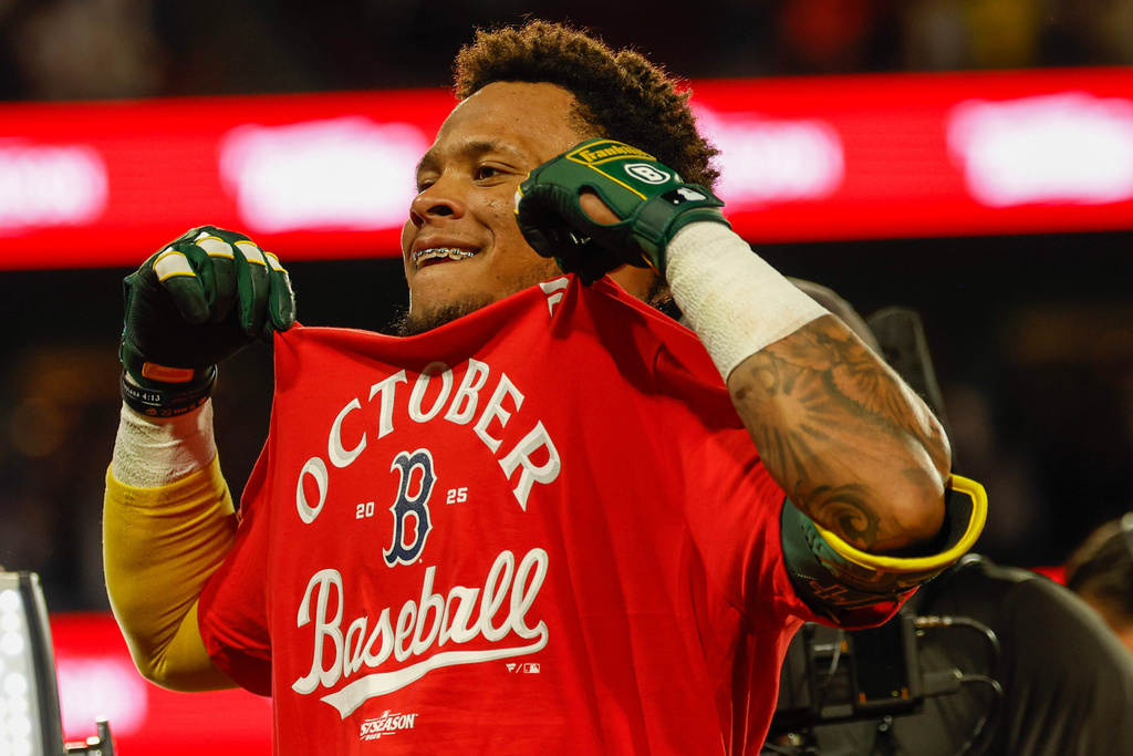 Boston Red Sox outfielder Ceddanne Rafaela (3) celebrates after defeating the Detroit Tigers in a baseball game to advance to the post season, Friday, Sept. 26, 2025, in Boston. (AP Photo/Greg M. Cooper)