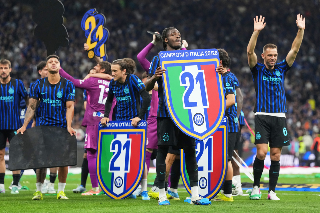 Inter players celebrate the victory of their 21st championship after a Serie A soccer match between Inter Milan and Parma, in Milan, Italy, Sunday, May 3, 2026. (AP Photo/Luca Bruno)