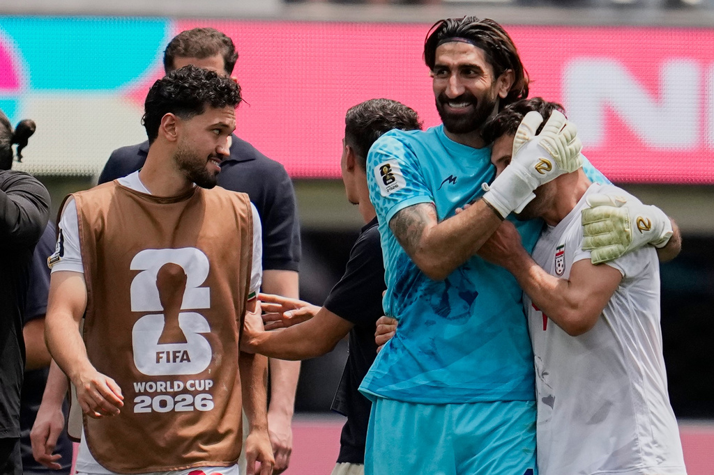 Iran players react at the end of the World Cup Group G soccer match between Belgium and Iran in Inglewood, Calif., near Los Angeles, Sunday, June 21, 2026. (AP Photo/Gregory Bull)