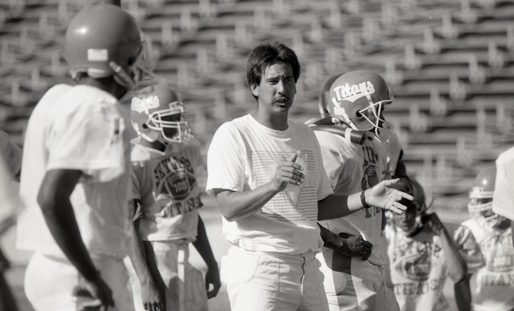 Skyline High School football coach John Beam talks to players at Skyline High School in Oakland, Calif., on Sept. 5, 1989. (Deanne Fitzmaurice/San Francisco Chronicle via AP)