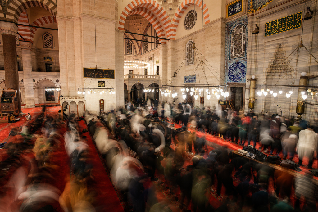 Worshippers perform the night prayer known as "Tarawih" on the eve of the first day of the Muslim holy month of Ramadan at the Suleymaniye Mosque in Istanbul, Wednesday, Feb. 18, 2026. (AP Photo/Emrah Gurel)