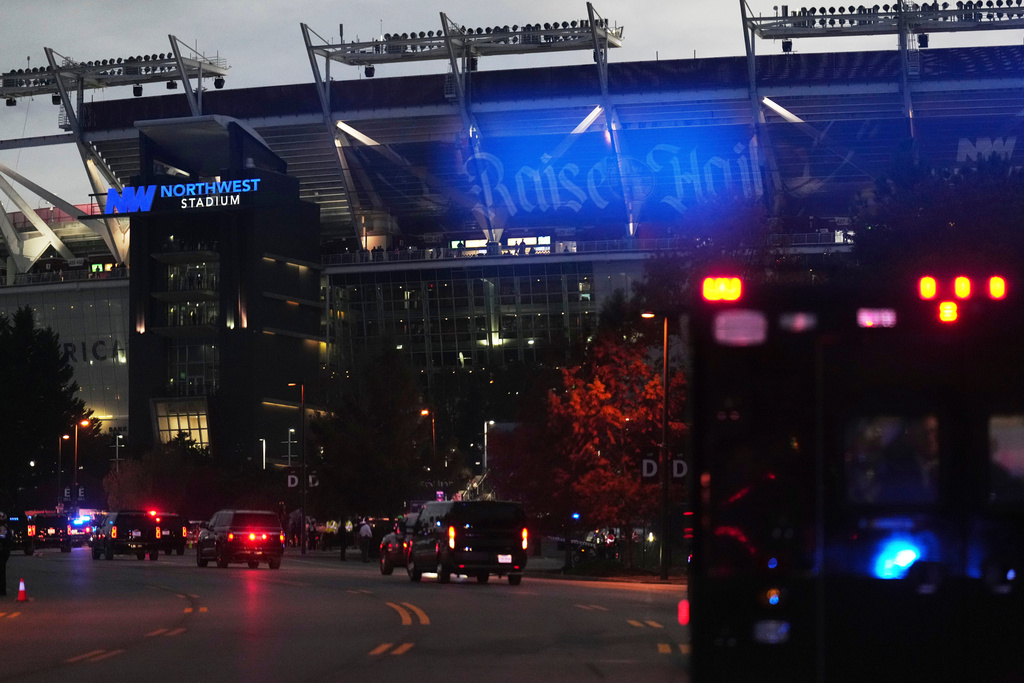 A motorcade for President Donald Trump arrives at Northwest Stadium before Trump attends an NFL football game between the Washington Commanders and the Detroit Lions, in Landover, Md., Sunday, Nov. 9, 2025. (AP Photo/Jacquelyn Martin)
