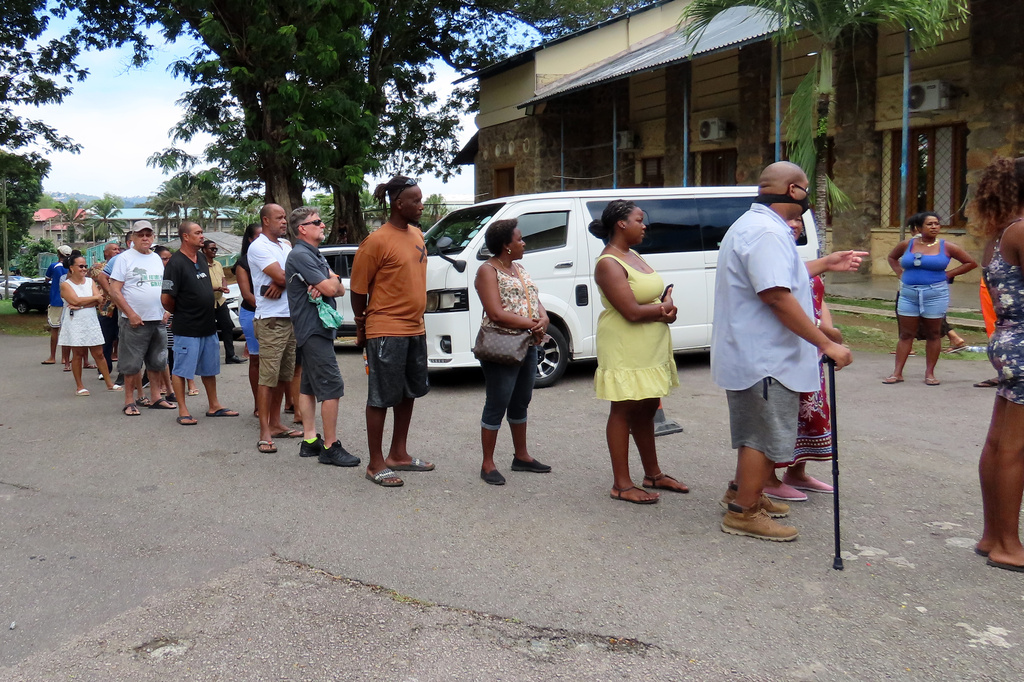 People line up to cast their votes at Bel Eau Primary School, Bel Air, Seychelles, on Saturday, Sep. 27, 2025. (AP Photo/Emilie Chetty)