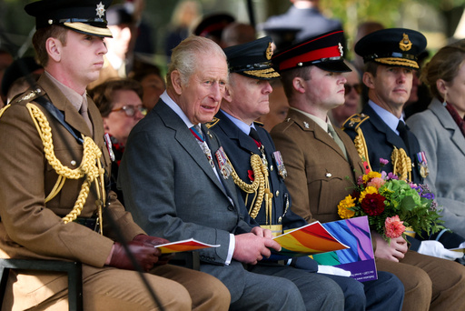Britain's King Charles, second from left, attends the LGBT+ Armed Forces Dedication Ceremony at the National Memorial Arboretum in Alrewas, England, Monday Oct. 27, 2025. (Phil Noble/Pool via AP) Britain's King Charles, second from left, attends the LGBT+ Armed Forces Dedication Ceremony at the National Memorial Arboretum in Alrewas, England, Monday Oct. 27, 2025. (Phil Noble/Pool via AP)