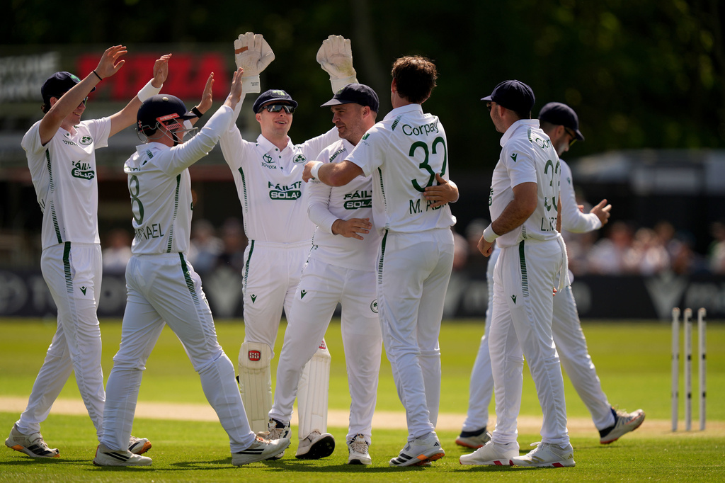 Ireland's Mark Adair celebrates bowling out New Zealand's Tom Latham on day one of the International Test Match between Ireland and New Zealand, in Belfast, Ireland, Wednesday May 27, 2026. (Niall Carson/PA via AP)