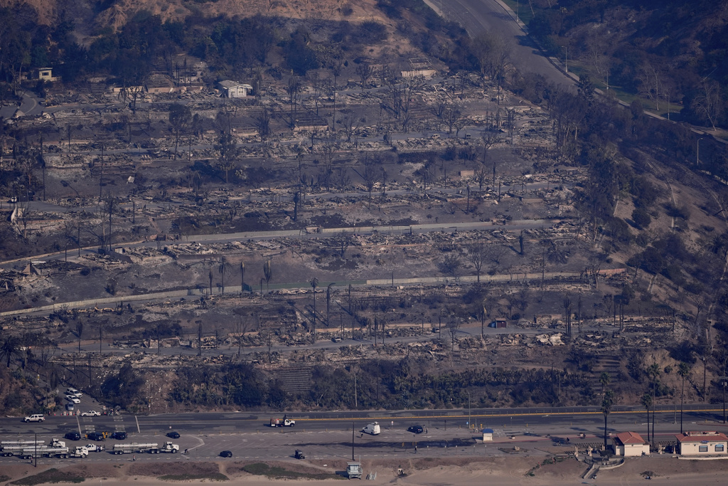 The devastation from the Palisades Fire is seen from the air in the Pacific Palisades neighborhood of Los Angeles, Thursday, Jan. 9, 2025. (AP Photo/Mark J. Terrill)