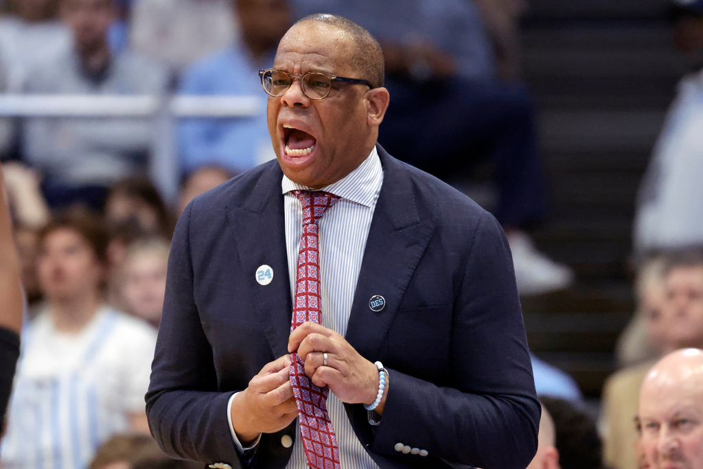 North Carolina head coach Hubert Davis yells instructions during the first half of an NCAA college basketball game against East Carolina, Monday, Dec. 22, 2025, in Chapel Hill, N.C. (AP Photo/Chris Seward)