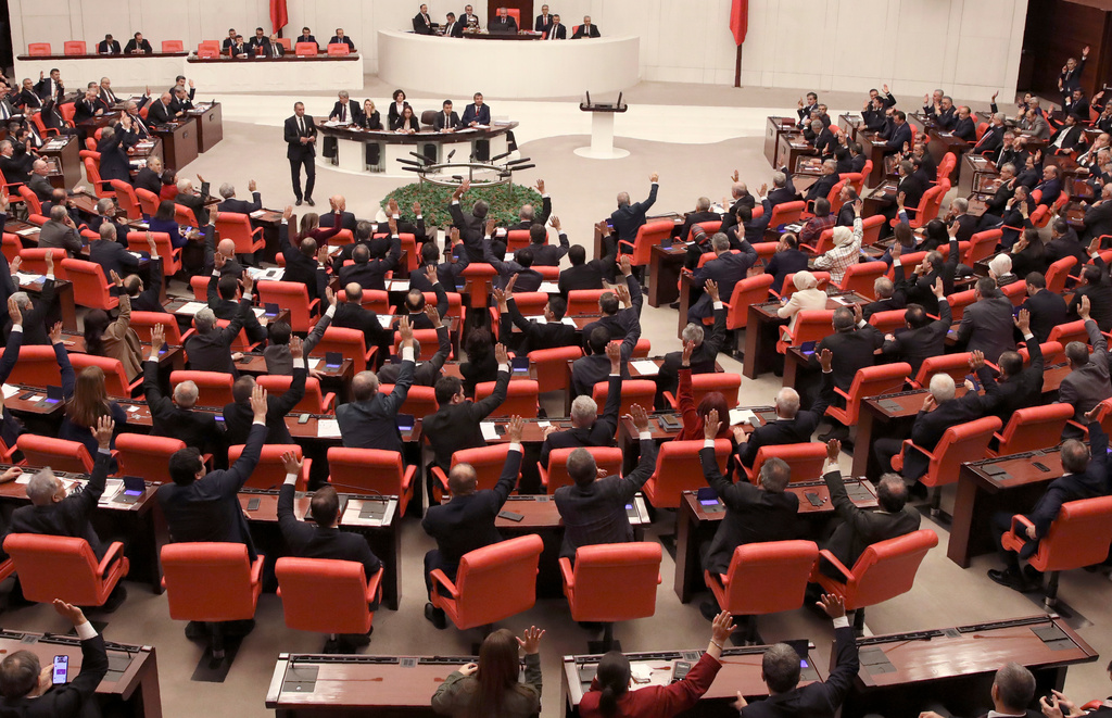 FILE - Members of Turkey's parliament vote in Ankara, Turkey, on Jan. 2, 2020. (AP Photo/Burhan Ozbilici, File)