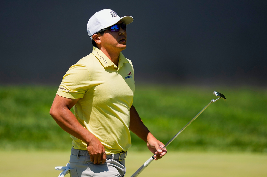 Kurt Kitayama walks across the first green after his shot during the third round of the PGA Championship golf tournament at Aronimink Golf Club, Saturday, May 16, 2026, in Newtown Square, PA. (AP Photo/Matt Slocum)