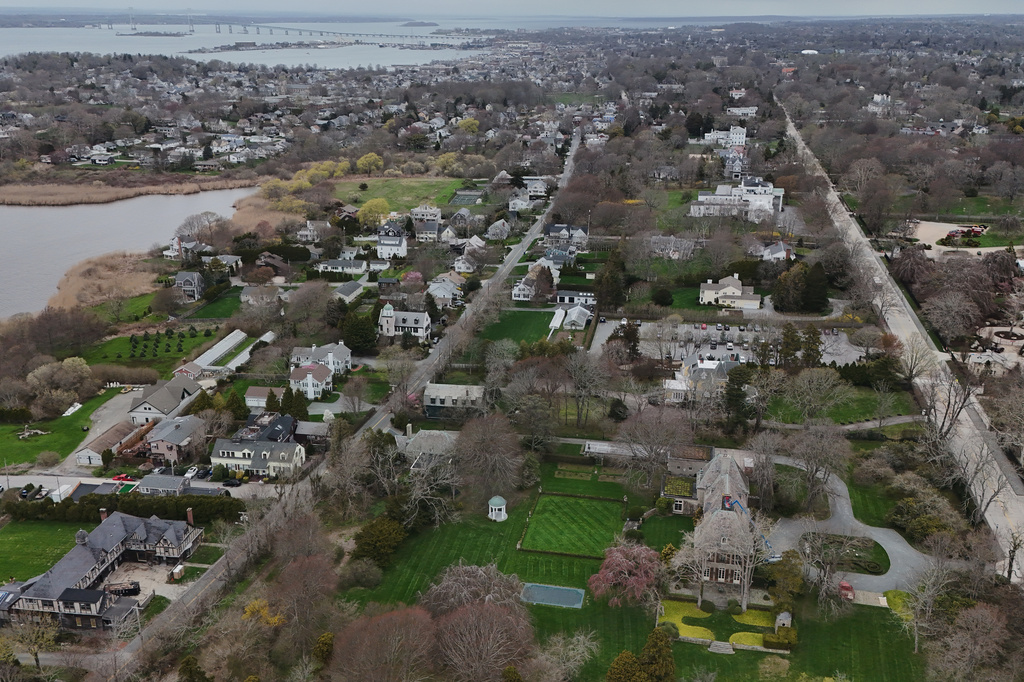 Trees surround homes Wednesday, April 22, 2026, in Newport, R.I. (AP Photo/Joshua A. Bickel)