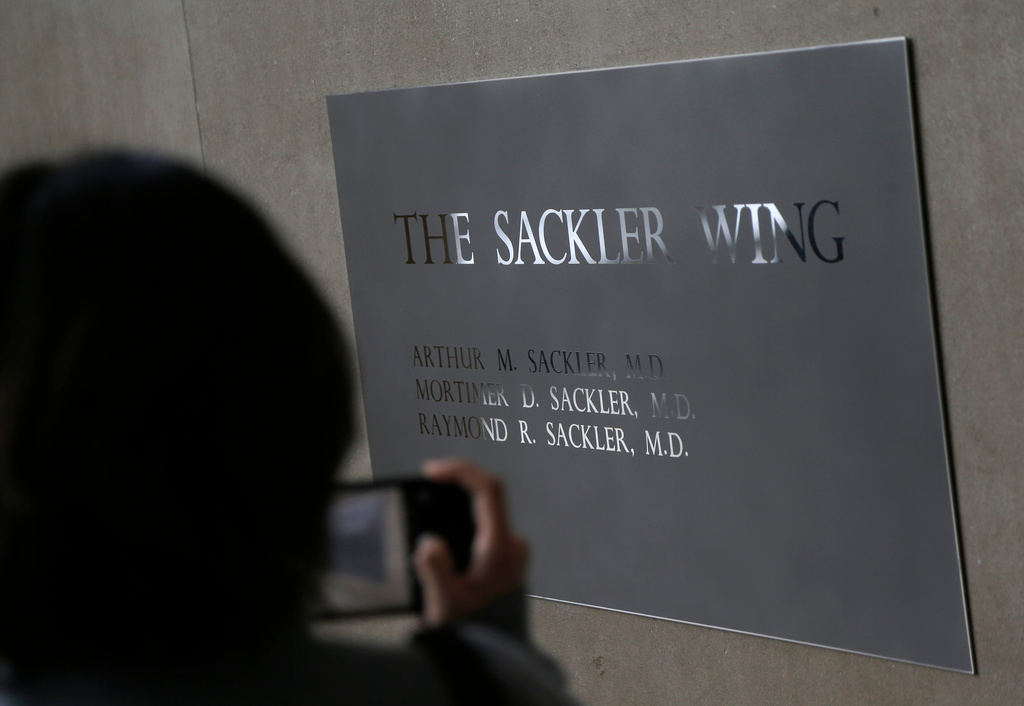 FILE - A sign with some names of the Sackler family is displayed at the Metropolitan Museum of Art Jan. 17, 2019, in New York. (AP Photo/Seth Wenig, File)