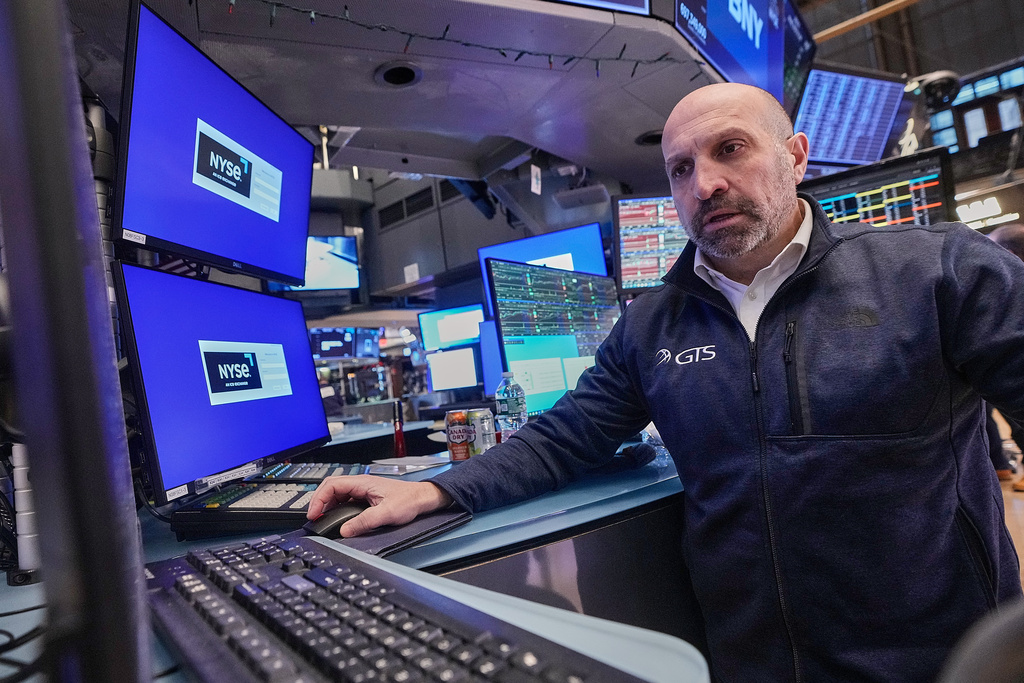 Specialist James Denaro works on the floor of the New York Stock Exchange, Monday, Jan. 26, 2026. (AP Photo/Richard Drew)