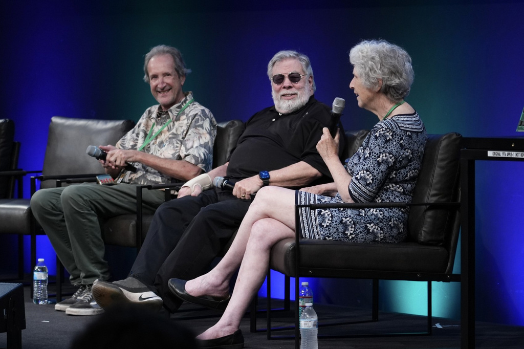 Apple co-founder Steve Wozniak, center, appears on stage at the Vintage Computer Festival in Mountain View, Calif., Sunday, Aug. 2, 2026. (AP Photo/Terry Chea)