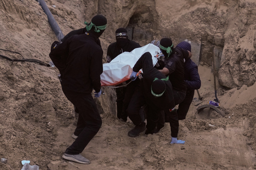 Hamas militants carry a white bag believed to contain a body, retrieved from a tunnel during a search for the remains of hostages in Hamad City, Khan Younis, southern Gaza, Tuesday, Oct. 28, 2025. (AP Photo/Jehad Alshrafi) Hamas militants carry a white bag believed to contain a body, retrieved from a tunnel during a search for the remains of hostages in Hamad City, Khan Younis, southern Gaza, Tuesday, Oct. 28, 2025. (AP Photo/Jehad Alshrafi)