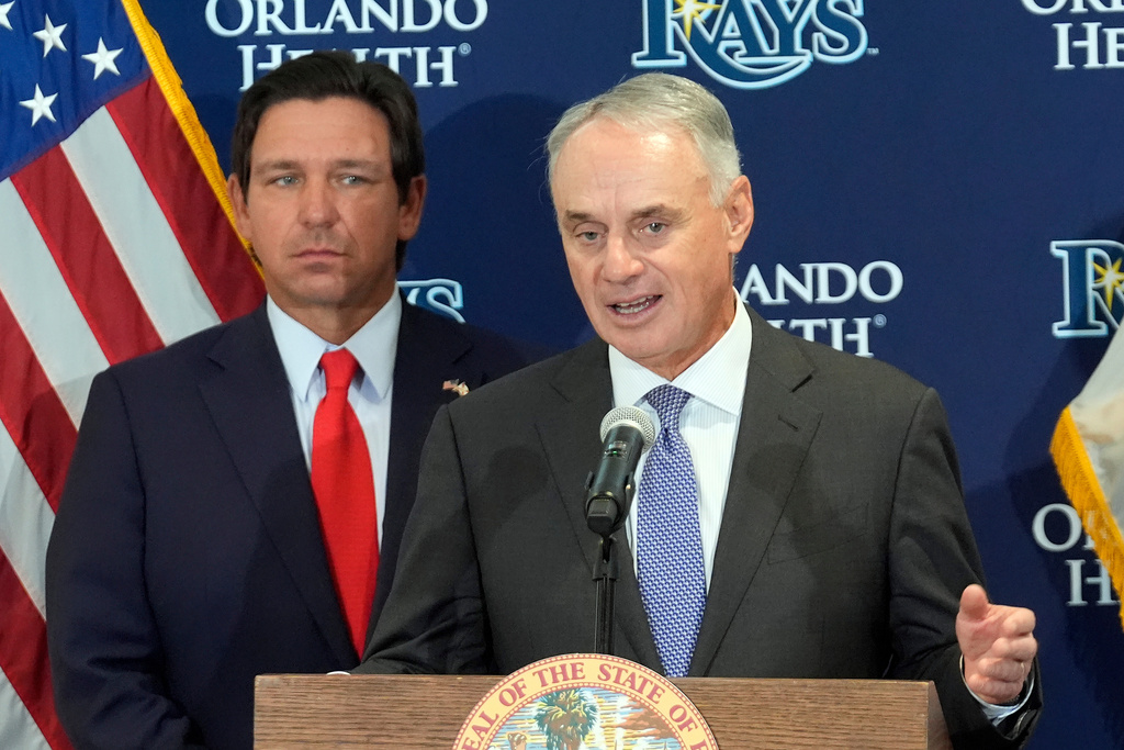 Major League Baseball commissioner Rob Manfred, right, speaks during a new baseball stadium news conference as Florida Gov. Ron DeSantis looks, Tuesday, Feb. 3, 2026, at Hillsborough College in Tampa, Fla. (AP Photo/Chris O'Meara)
