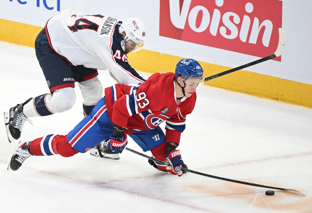 Columbus Blue Jackets' Erik Gudbranson (44) defends against Montreal Canadiens' Ivan Demidov (93) during the second period of an NHL hockey game, in Montreal, Thursday, March 26, 2026. (Graham Hughes/The Canadian Press via AP)