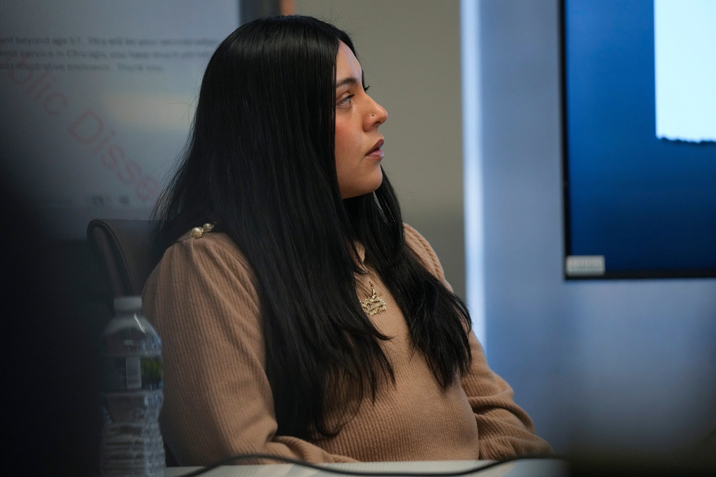 Marimar Martinez, a woman who was shot by a Border Patrol agent last year, sits with her attorneys during a press conference Wednesday, Feb. 11, 2026, in Chicago. (AP Photo/Erin Hooley)