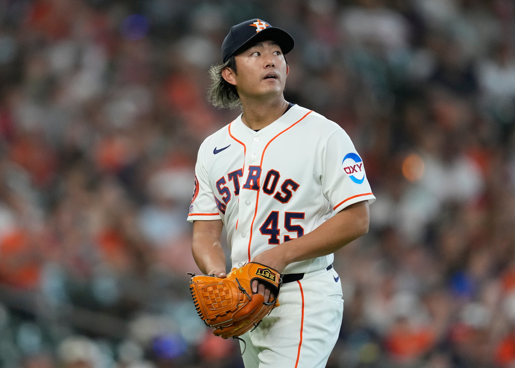 Houston Astros starting pitcher Tatsuya Imai returns to the dugout after the top of the second inning of a baseball game against the Los Angeles Angels in Houston, Sunday, March 29, 2026. (AP Photo/Ashley Landis)