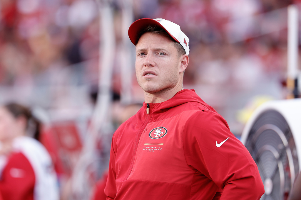 San Francisco 49ers running back Christian McCaffrey stands on the sideline before a preseason NFL football game against the Tennessee Titans, Thursday, Aug. 13, 2026, in Santa Clara, Calif. (AP Photo/Kelley L. Cox)