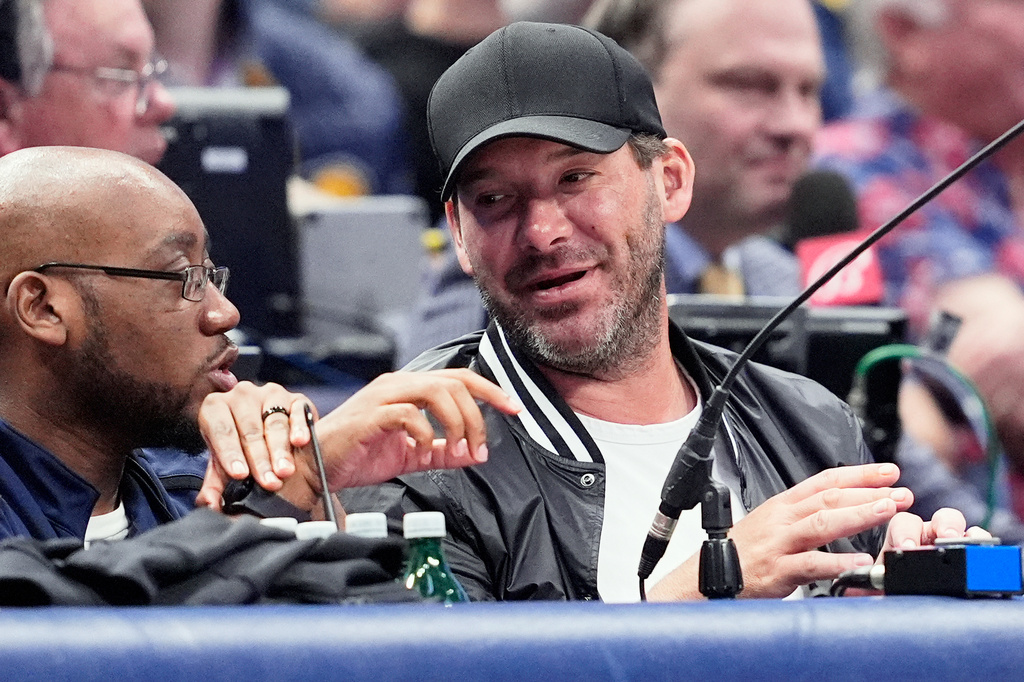 FILE - Former NFL quarterback Tony Romo, right, attends an NBA basketball game between the Indiana Pacers and the Dallas Mavericks on March 5, 2024, in Dallas. (AP Photo/Tony Gutierrez, File)