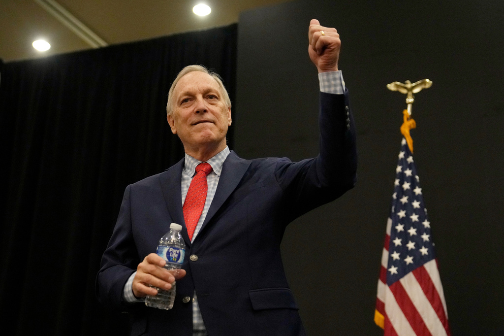 Rep. Andy Biggs, R-Ariz., who is running in the primary for Arizona governor, gives a thumbs up to supporters at a campaign event, Friday, July 17, 2026, in Gilbert, Ariz. (AP Photo/Ross D. Franklin)