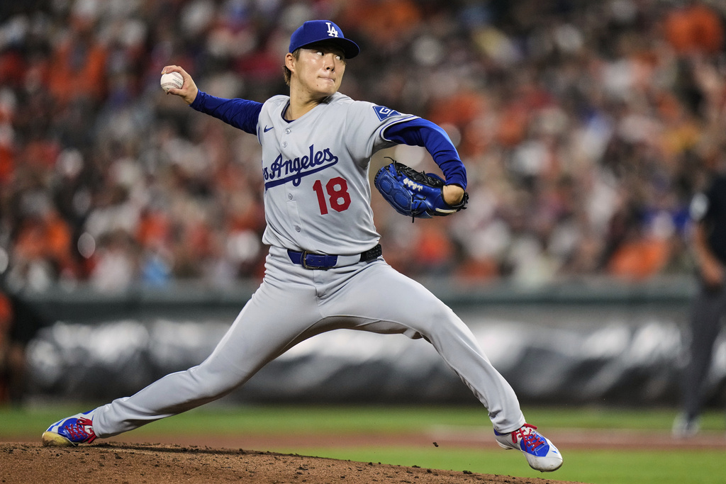 Los Angeles Dodgers starting pitcher Yoshinobu Yamamoto (18) delivers during the second inning of a baseball game against the Baltimore Orioles, Saturday, Sept. 6, 2025, in Baltimore. (AP Photo/Stephanie Scarbrough)