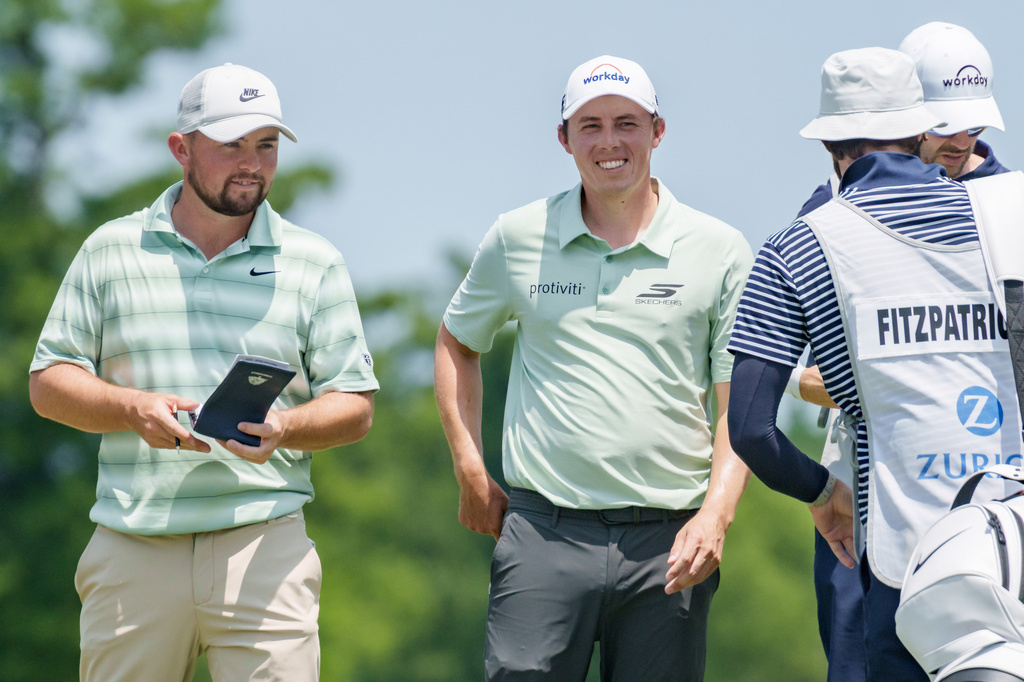 Brothers Alex, left, and Matt Fitzpatrick, second from left, of England, smile on the second hole during the final round of the PGA Zurich Classic of New Orleans golf tournament, Sunday, April 26, 2026, in Avondale, La. (AP Photo/Matthew Hinton)