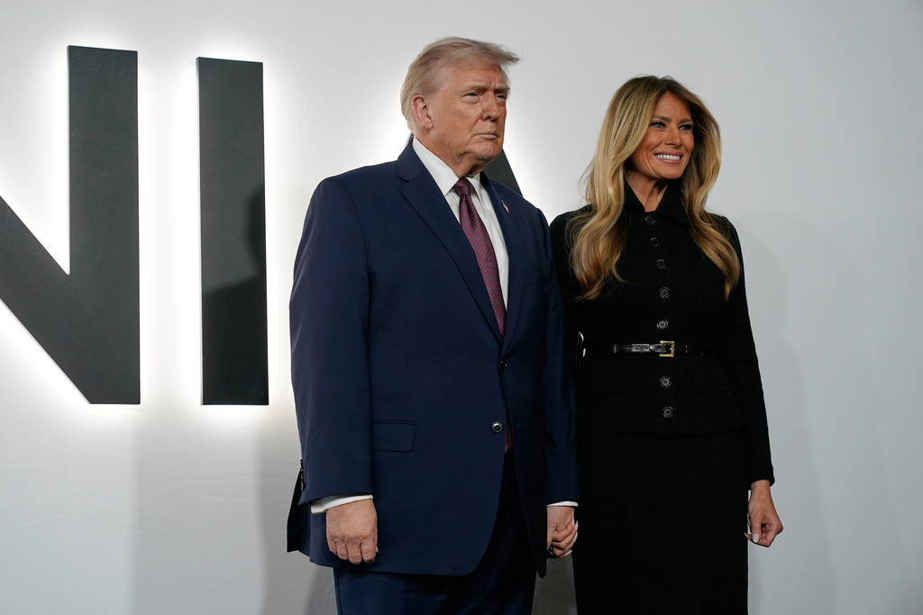 President Donald Trump and first lady Melania Trump arrive for the premiere of her movie "Melania" at The John F. Kennedy Memorial Center For The Performing Arts, Thursday, Jan. 29, 2026, in Washington. (AP Photo/Jose Luis Magana)