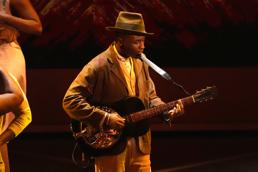 Miles Caton, far left, performs 'I Lied to You' from "Sinners" during the Oscars on Sunday, March 15, 2026, at the Dolby Theatre in Los Angeles. (AP Photo/Chris Pizzello)