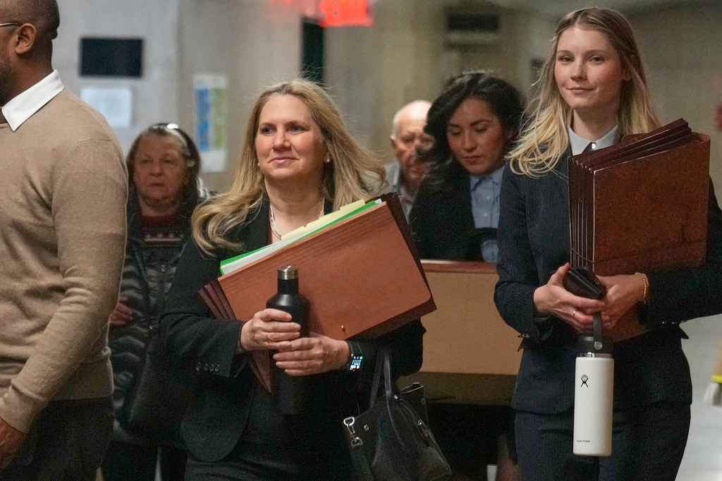 Assistant District Attorney Nicole Blumberg, center, and Manhattan Assistant District Attorney Candace White, right, arrive for the first day of Harvey Weinstein's third trial, in criminal court in New York, Tuesday, April 21, 2026. (AP Photo/Richard Drew) ADDITION: adding Manhattan Assistant District Attorney Candace White