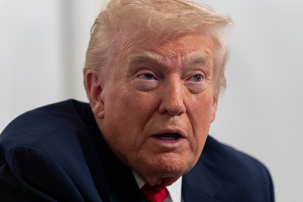 President Donald Trump speaks to reporters after speaking to troops via video from his Mar-a-Lago estate on Thanksgiving, Thursday, Nov. 27, 2025, in Palm Beach, Fla. (AP Photo/Alex Brandon)