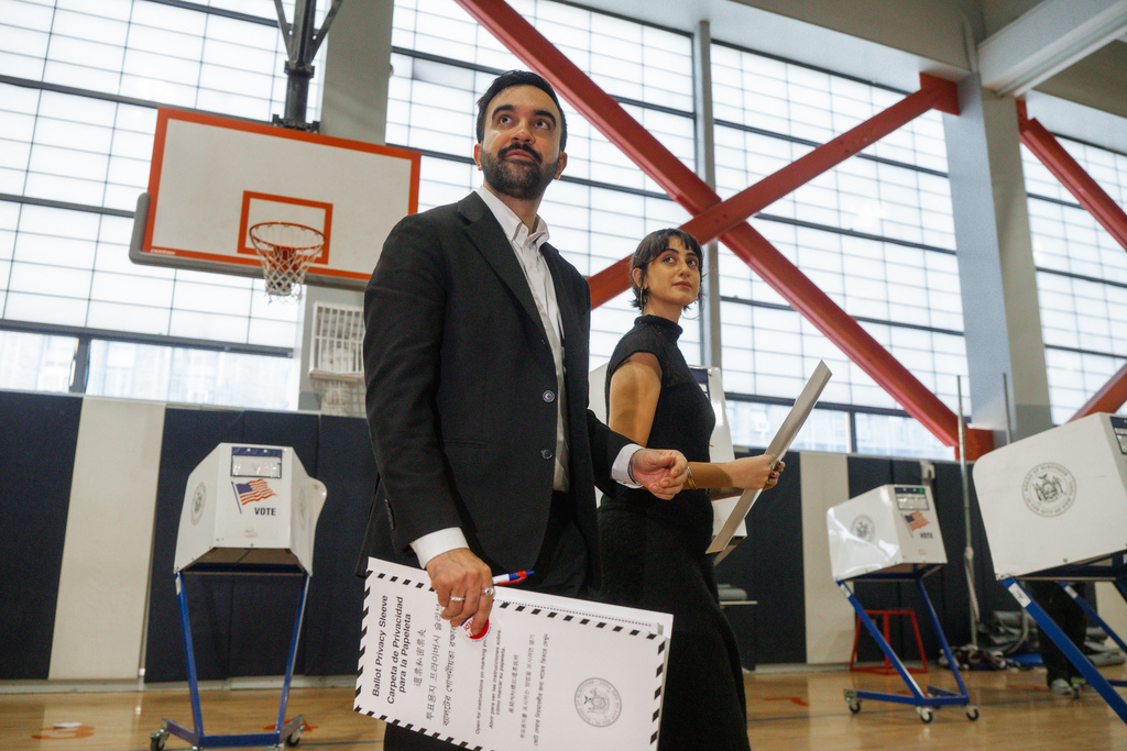 New York mayoral candidate Zohran Mamdani and his wife Rama Sawaf Duwaji vote on Election Day, Tuesday, Nov. 4, 2025, in New York. (AP Photo/Olga Fedorova)