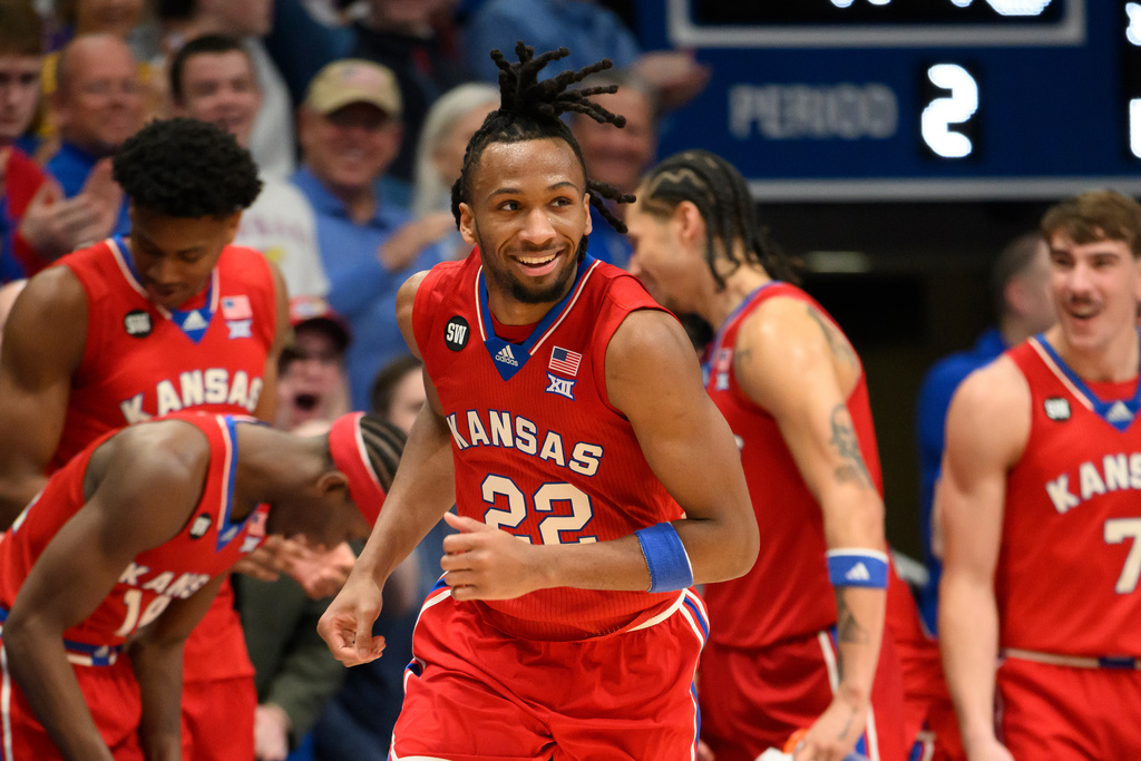 Kansas guard Darryn Peterson (22) was all smiles after a dunk against Kansas State during the second half of an NCAA college basketball game in Lawrence, Kan., Saturday, March 7, 2026. (AP Photo/Reed Hoffmann)
