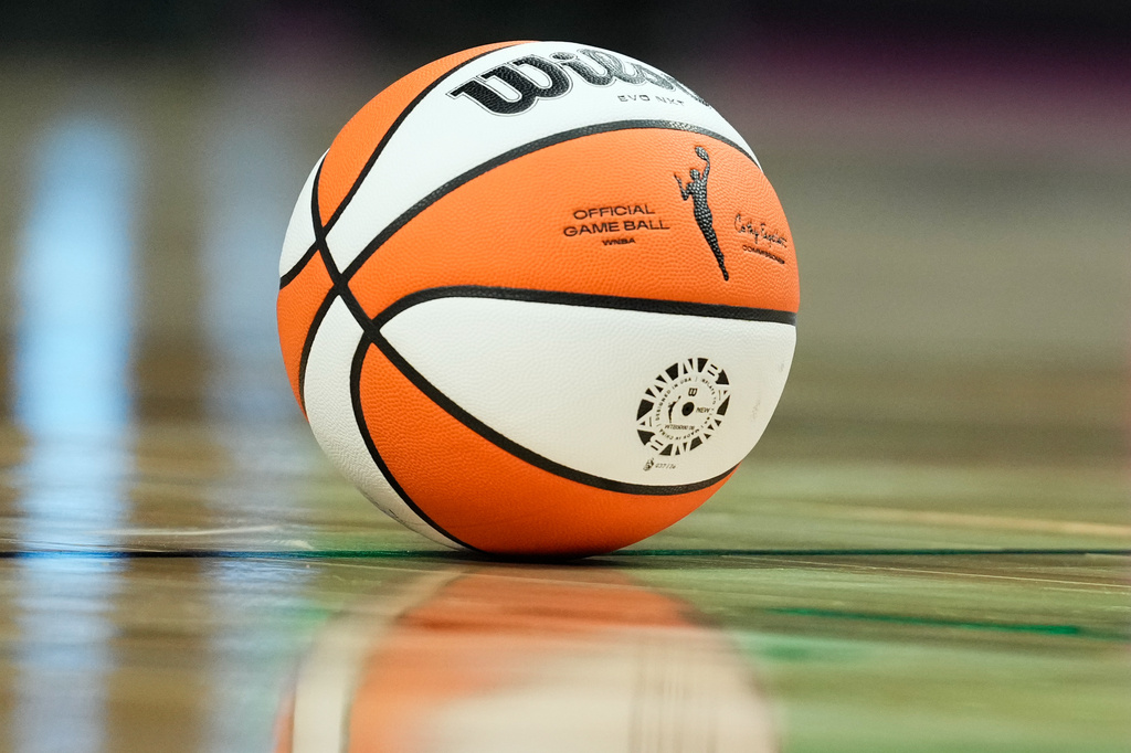 FILE - The official game ball rests on the court during a time out in the second half of a WNBA basketball game between the Portland Fire and the Chicago Sky, May 9, 2026, in Portland, Ore. (AP Photo/Jenny Kane, File)