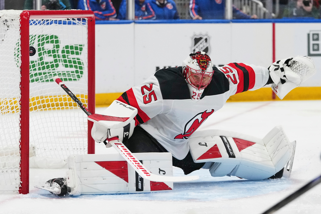 New Jersey Devils goaltender Jacob Markstrom (25) reacts as a puck shot by New York Islanders' Mathew Barzal gets past him for a goal during the first period of an NHL hockey game Tuesday, Jan. 6, 2026, in Elmont, N.Y. (AP Photo/Frank Franklin II)