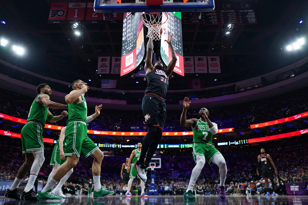 Philadelphia 76ers' Joel Embiid (21) goes up for a shot during the first half of Game 4 against the Boston Celtics in a first-round NBA basketball playoffs series Sunday, April 26, 2026, in Philadelphia. (AP Photo/Matt Slocum)