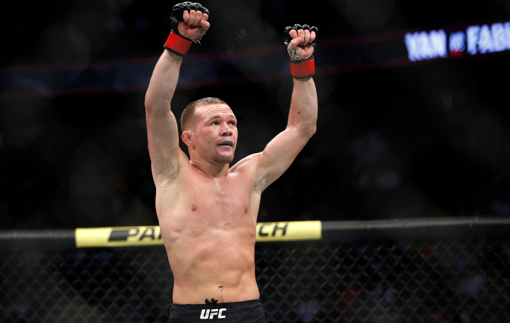 FILE - Petr Yan celebrates after defeating Urijah Faber in a mixed martial arts bantamweight bout at UFC 245, Saturday, Dec. 14, 2019, in Las Vegas. (AP Photo/John Locher, File)