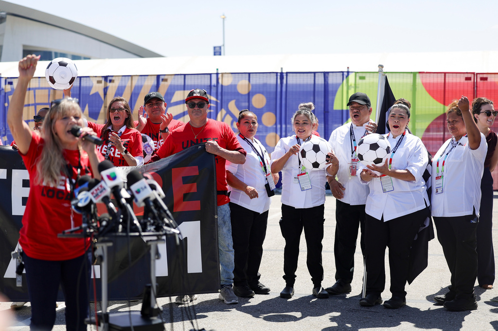 Food and beverage workers cheer during a news conference represented by UNITE HERE Local 11 in front of Sofi Stadium Tuesday, Jun. 9, 2026 in Inglewood, Calif. (AP Photo/Ryan Sun)