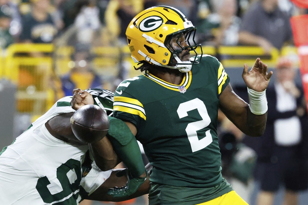 New York Jets' Leonard Taylor III forces Green Bay Packers' Malik Willis to fumble in the endzone during the first half of a preseason NFL football game Saturday, Aug. 9, 2025, in Green Bay, Wis. (AP Photo/Mike Roemer)