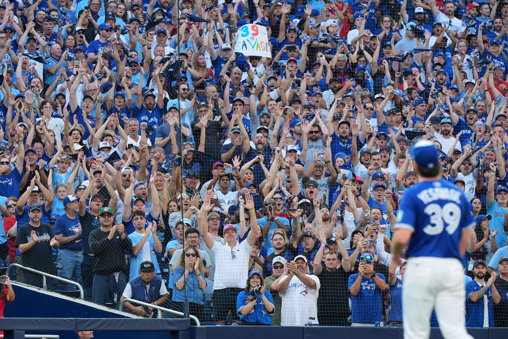 Fans give a standing ovation as Toronto Blue Jays pitcher Trey Yesavage (39) leaves the mound after being pulled during the sixth inning of Game 2 of baseball's American League Division Series against the New York Yankees in Toronto, Sunday, Oct. 5, 2025. (Frank Gunn/The Canadian Press via AP)
