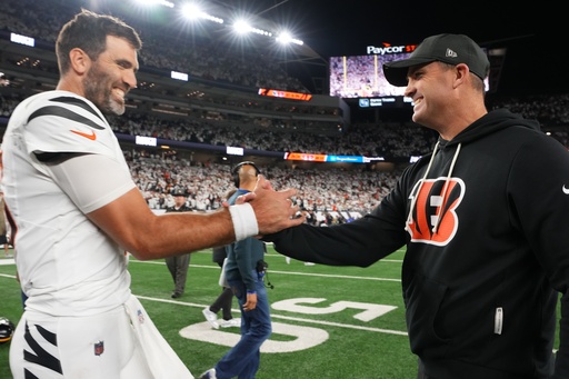 Cincinnati Bengals quarterback Joe Flacco, left, celebrates with head coach Zac Taylor after an NFL football game against the Pittsburgh Steelers in Cincinnati Thursday, Oct. 16, 2025. (AP Photo/Jeff Dean) Cincinnati Bengals quarterback Joe Flacco, left, celebrates with head coach Zac Taylor after an NFL football game against the Pittsburgh Steelers in Cincinnati Thursday, Oct. 16, 2025. (AP Photo/Jeff Dean)